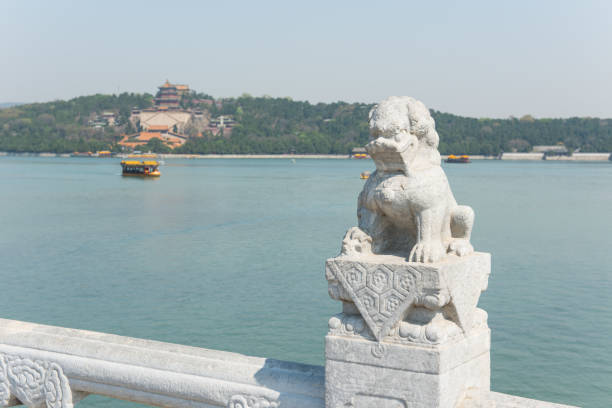 istock Stone lion by the lake. 960686254