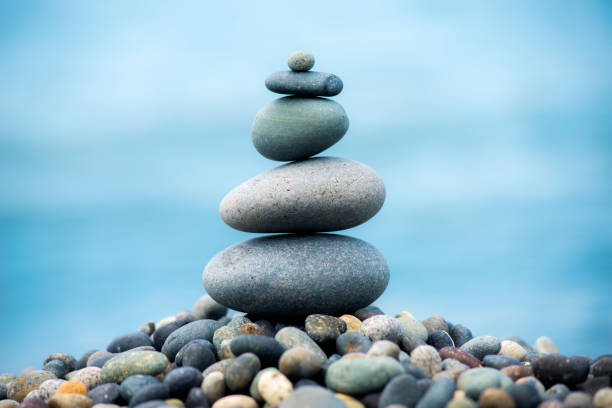 istock Making pyramids from beach pebbles. Nature and balance concept/ Artvin,Turkey,25 July 2017 960686740