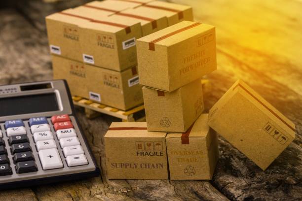 istock Pile of cardboard boxes products on wood pallet with calculator. Ideas for assembling a portfolio of assets which are held directly by investors. which expected return is maximized for a given level. 960696030