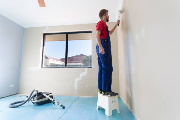 istock A young man painting a home interior. 960699200