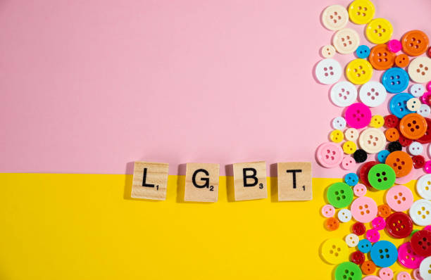istock LGBT collected from elements wooden cube with colourful buttons on pastel pink and yellow background 960699350