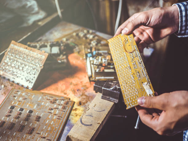 istock close up hand repairing board circuit chip in workshop 960702758