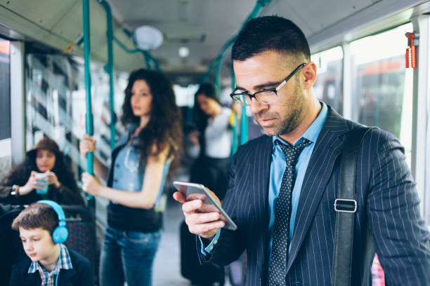istock Businessman using smart phone inside of public transport 960703124