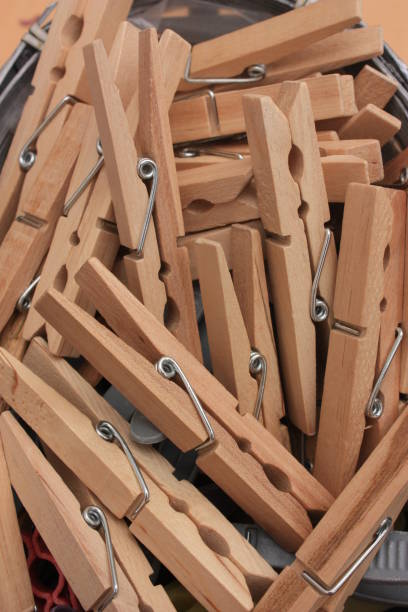 istock Wooden clothespins in a wicker basket 960706858