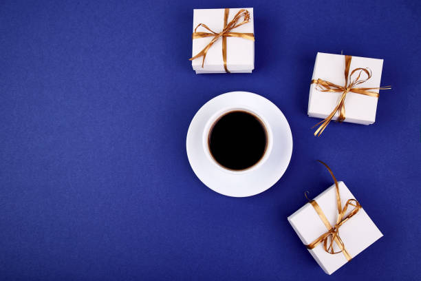 istock White gift box with gold ribbon 960715538