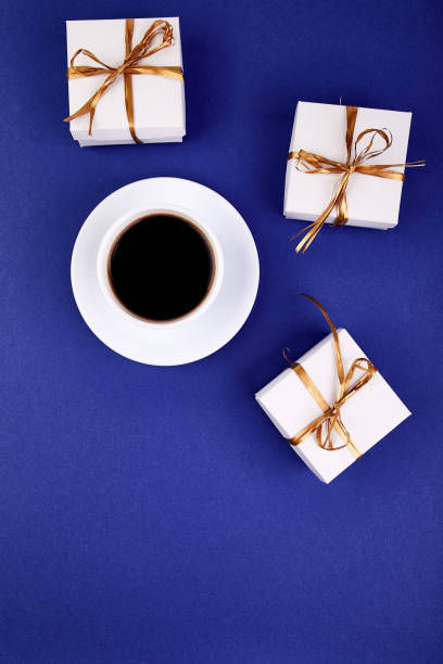 istock White gift box with gold ribbon 960715542