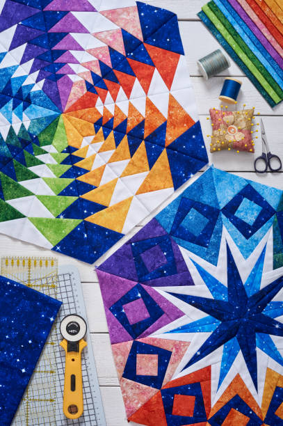 istock Fragments of quilt, accessories for patchwork, top view on a white wooden surface 960727642