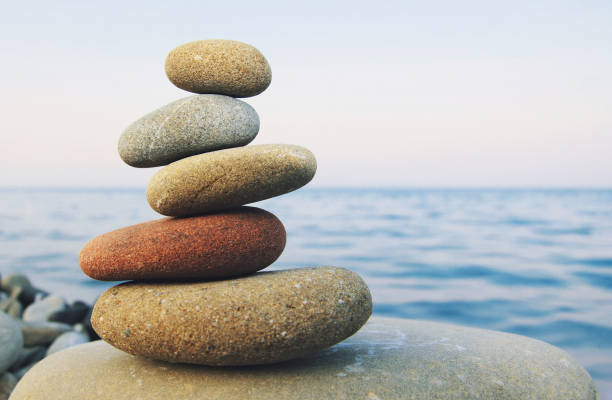 hierarchy and balance - aspirations pebble balance stack imagens e fotografias de stock