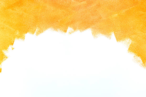 istock orange color painting by paint roller on the wall background 960735620