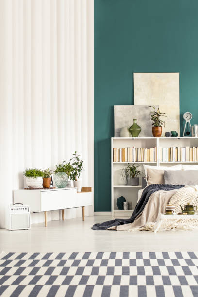 istock White and green bedroom interior 960739706
