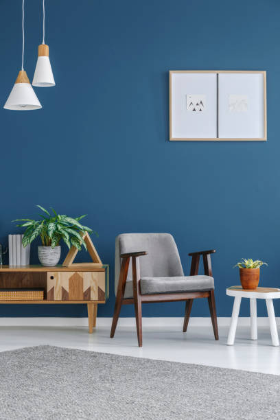istock Grey armchair with wooden frame 960743516