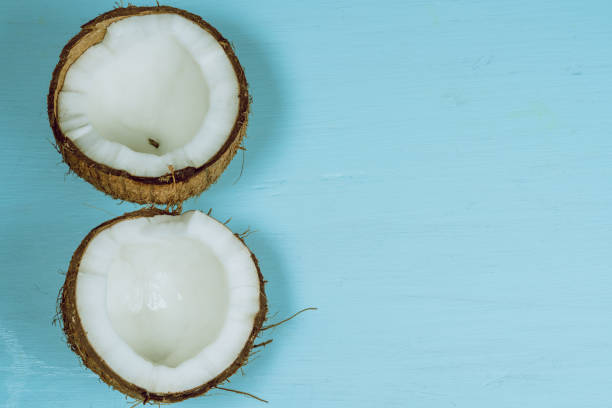 istock broken coconut on wooden 960743960