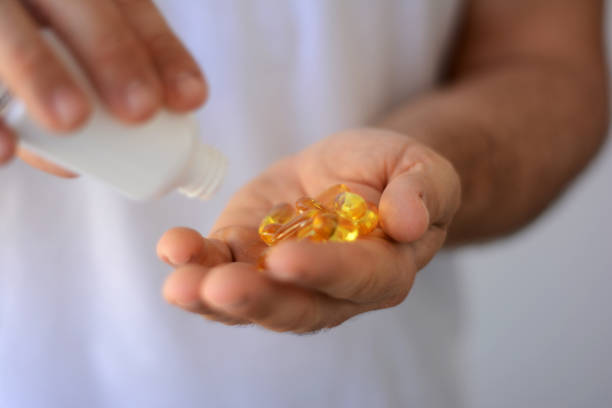 istock Fish Oil Hand 960749226