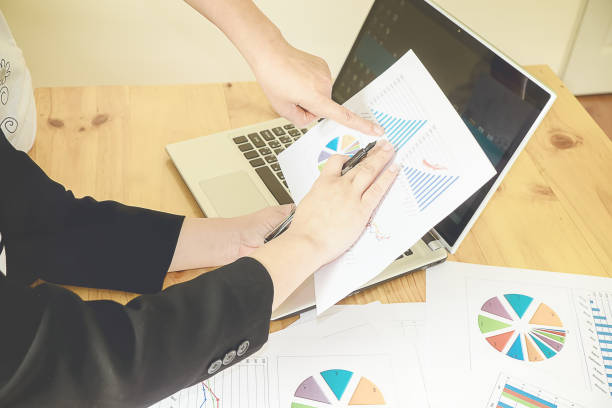 istock Business team meeting working with new startup project.discussion and analysis data the charts and graphs.Digital tablet laptop computer smart phone using,Business finances and accounting concept 960749682