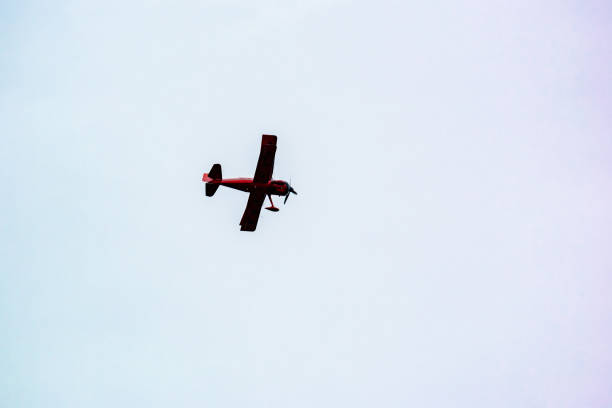istock Low Angle View Of Airplane Flying Against Clear Sky 960754234