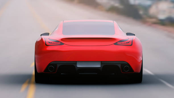 istock red car driving on a road 960754314