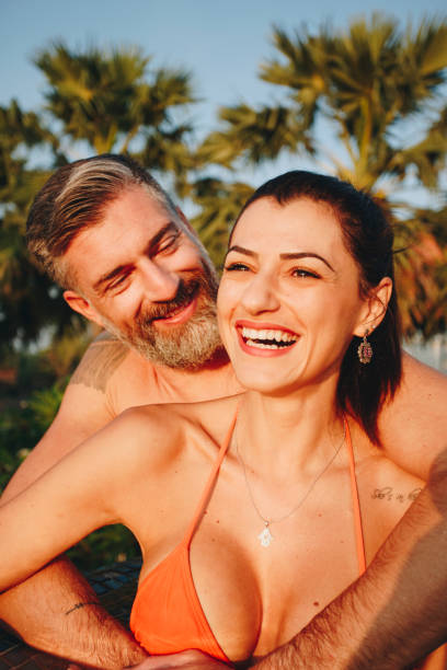 istock Honeymooners in a swimming pool at a resort 960757038