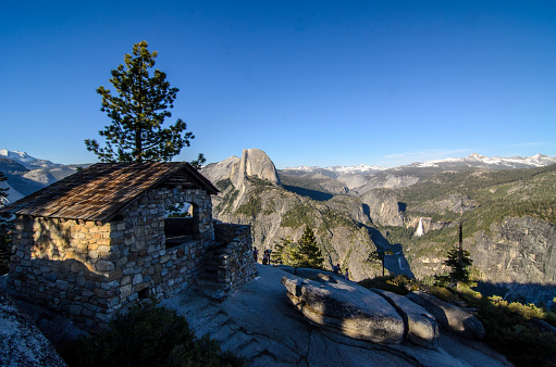 Yosemite National Park view from Glacier point with old brick building in shot.