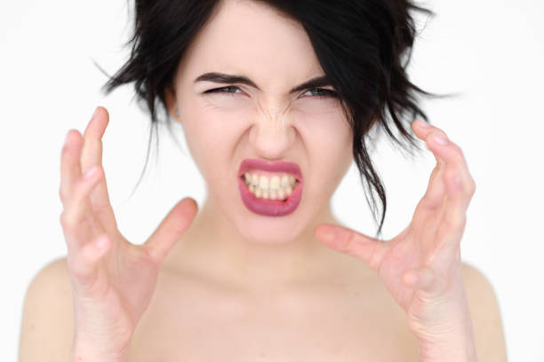 istock emotion face rage fury strangle woman baring teeth 960758642