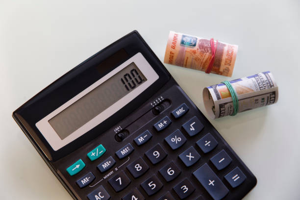 istock Money american dollar russian ruble and black calculator 960772906