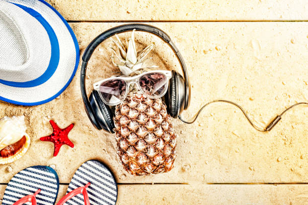 istock beach, seaside vacation, Pineapple, on the beach, headphones, vacation. top view 960776962