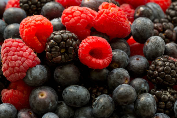istock Fresh juicy organic blueberries, raspberries, blackberries, close up image 960784852