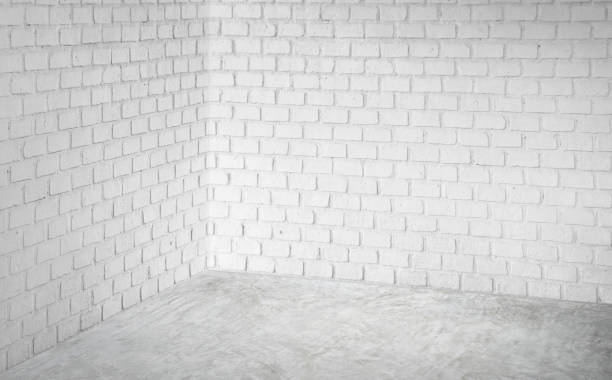 istock Empty corner white modern brick wall and grey concrete floor perspective room,Modern style room,Mock up for display of product,business presentation 960790810