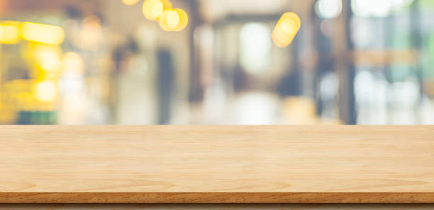 istock Empty wood table top with blurred cafe restaurant background. Mock up for display or montage of product,Business presentation 960791022