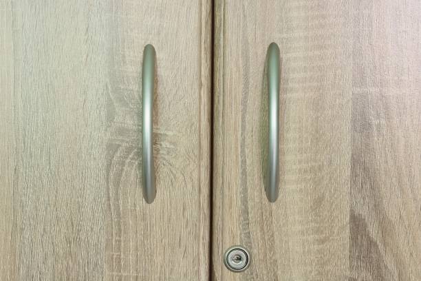 istock Brown wooden wardrobe drawer with one keyhole 960796398