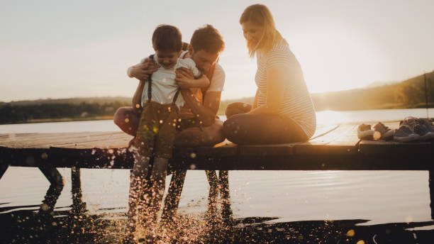 istock Family on a lake dock 960799162
