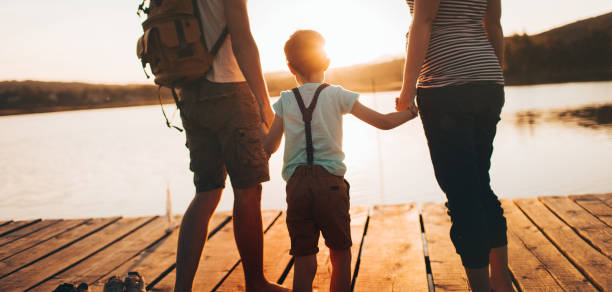 istock Family on a lake dock 960799346