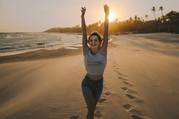 istock Woman  resting  on the beach in Mui Ne   at sunset 960800752