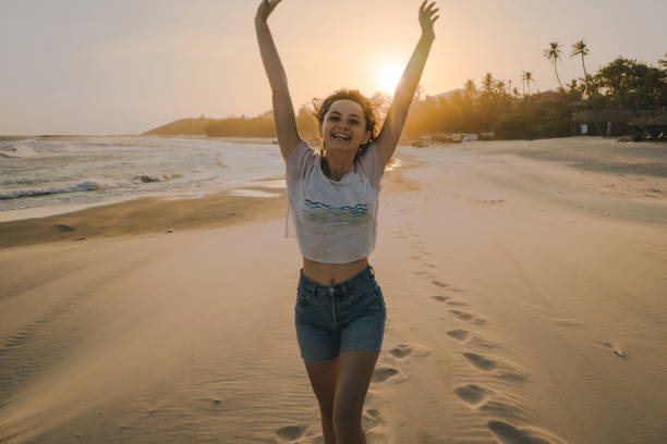 istock Woman  resting  on the beach in Mui Ne   at sunset 960801054