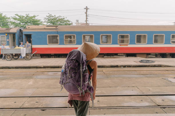istock Tourist standing on railway platform waiting for train 960803870