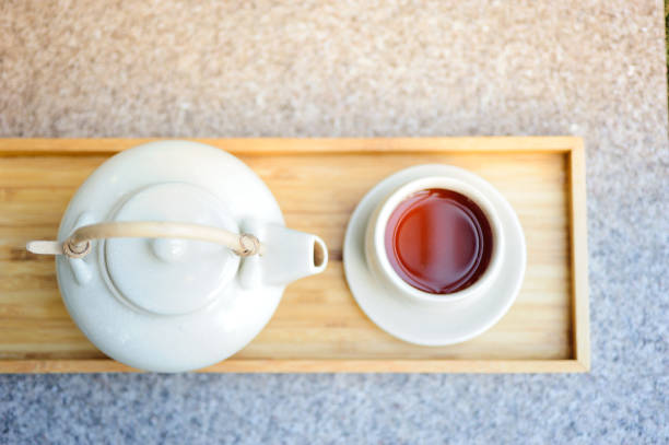 istock Hot tea is in a glass on a wooden tray. 960808082