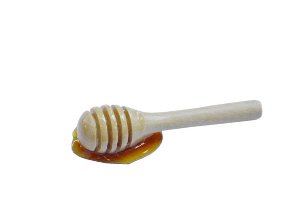 istock wooden honey scoop on white background 960818152