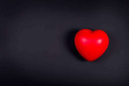 Red heart on a black background