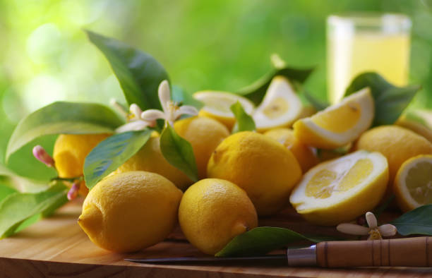 istock ripe lemons and knife on wooden table 960822768