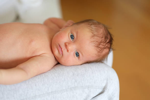 istock One month old newborn baby with mother 960824352