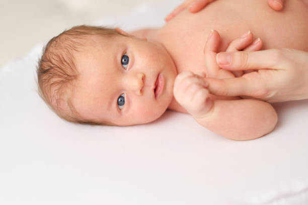 istock One month old newborn baby with mother 960824452