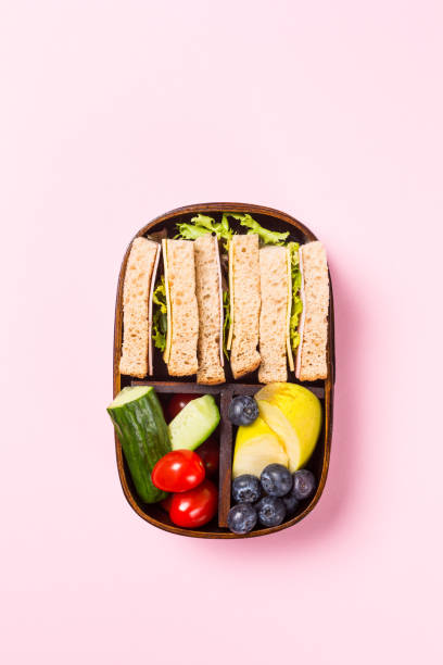 istock School wooden lunch box with sandwiches 960828906