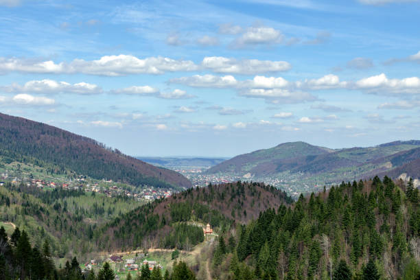 istock Small village in the Carpathian mountains in a valley surrounded by forests. Soft focus. Beautiful plan. 960842810