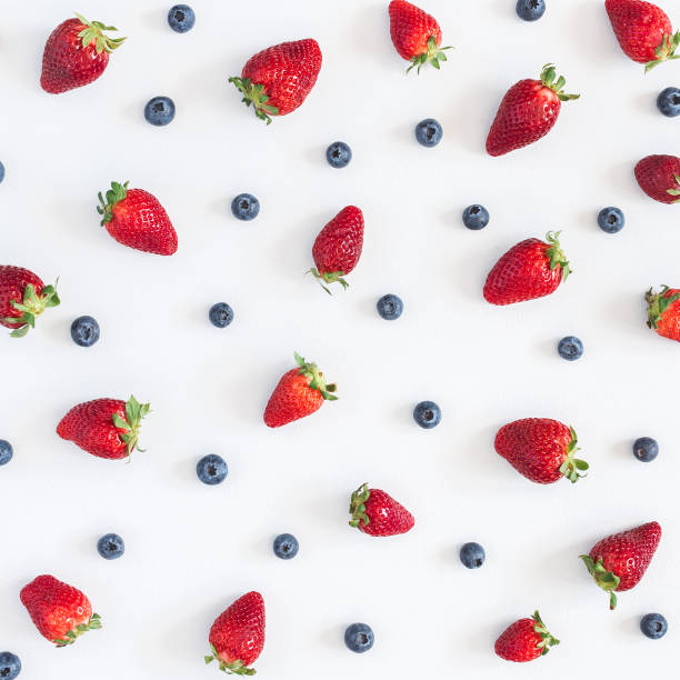 istock Strawberry blueberry pattern on gray background. Flat lay, top view 960847782