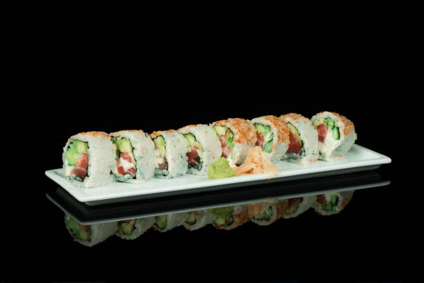 istock varieties of sushi on black background 960850968