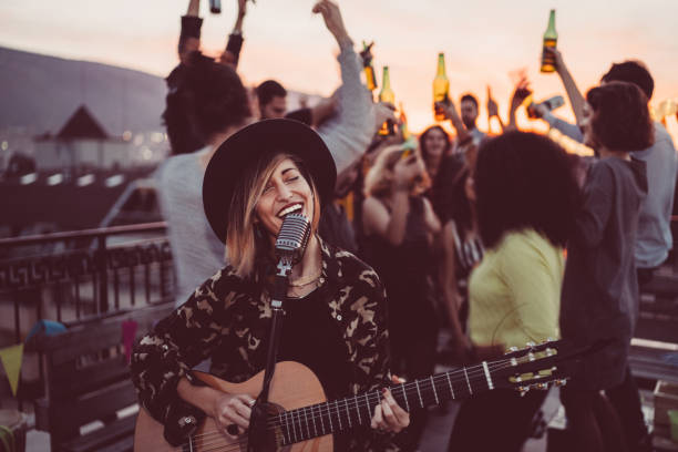 istock Friends partying at the rooftop on sunset 960851436