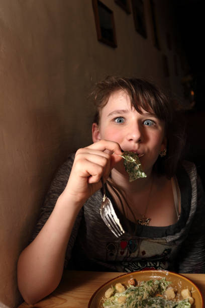 istock Teen eating salad 960852250