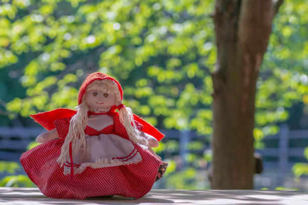 Little Red riding hood doll on Little Red Riding Hood on Bokeh Background