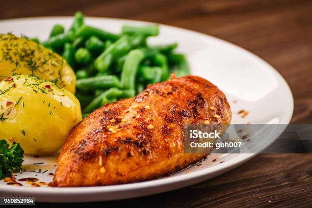 Roast Chicken Breast Boiled Potatoes And Vegetables Stock Photo - Download Image Now