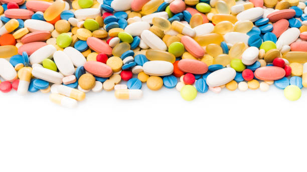 白薬の境界線。カラフルな錠剤を白で隔離 - perscription capsule frame pill ストックフォトと画像