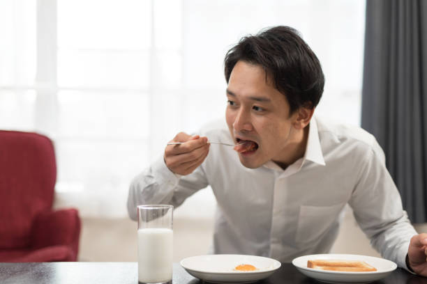 businessman eating breakfast in his house